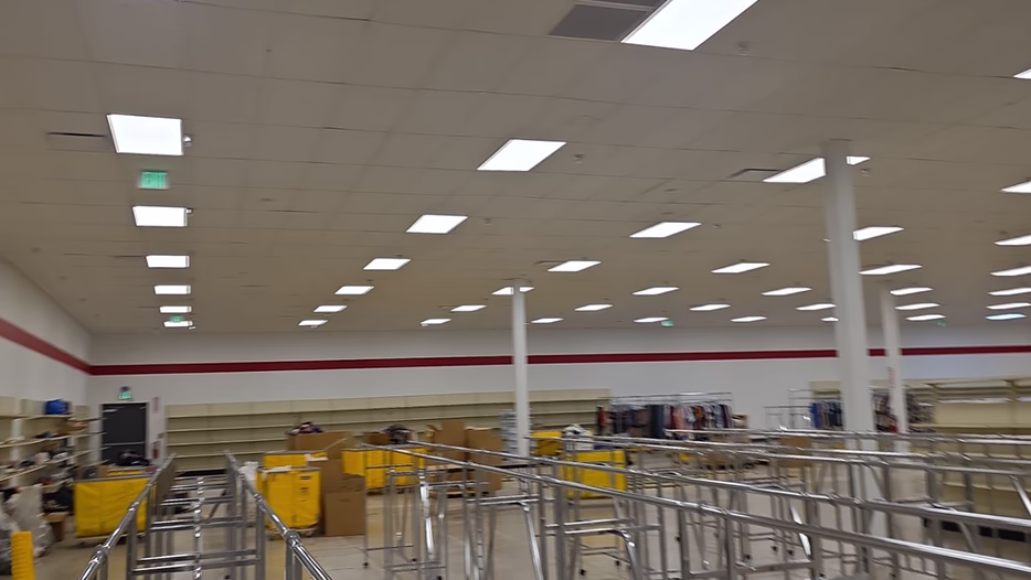 Recessed LED troffer lighting installed across 
the drop ceiling of a commercial retail store by Modern Electric